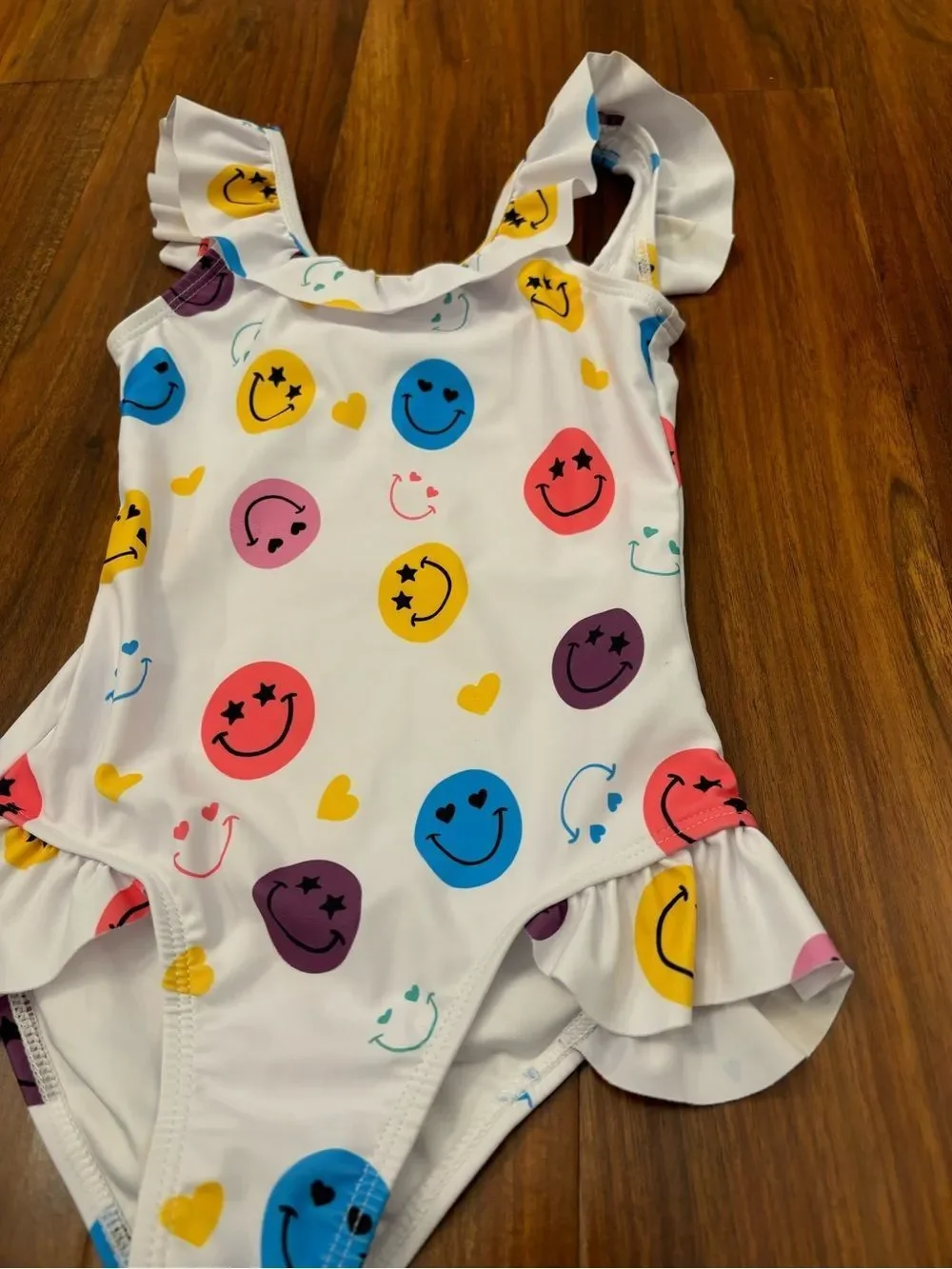 Lola + The Boys white smiley face one piece ruffle bathing suit